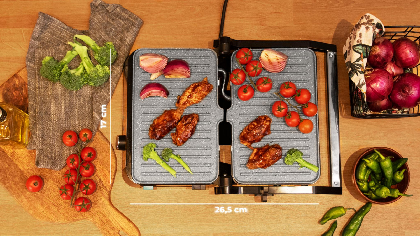 Amplia superficie de cocinado de 28,7 x 17 cm.